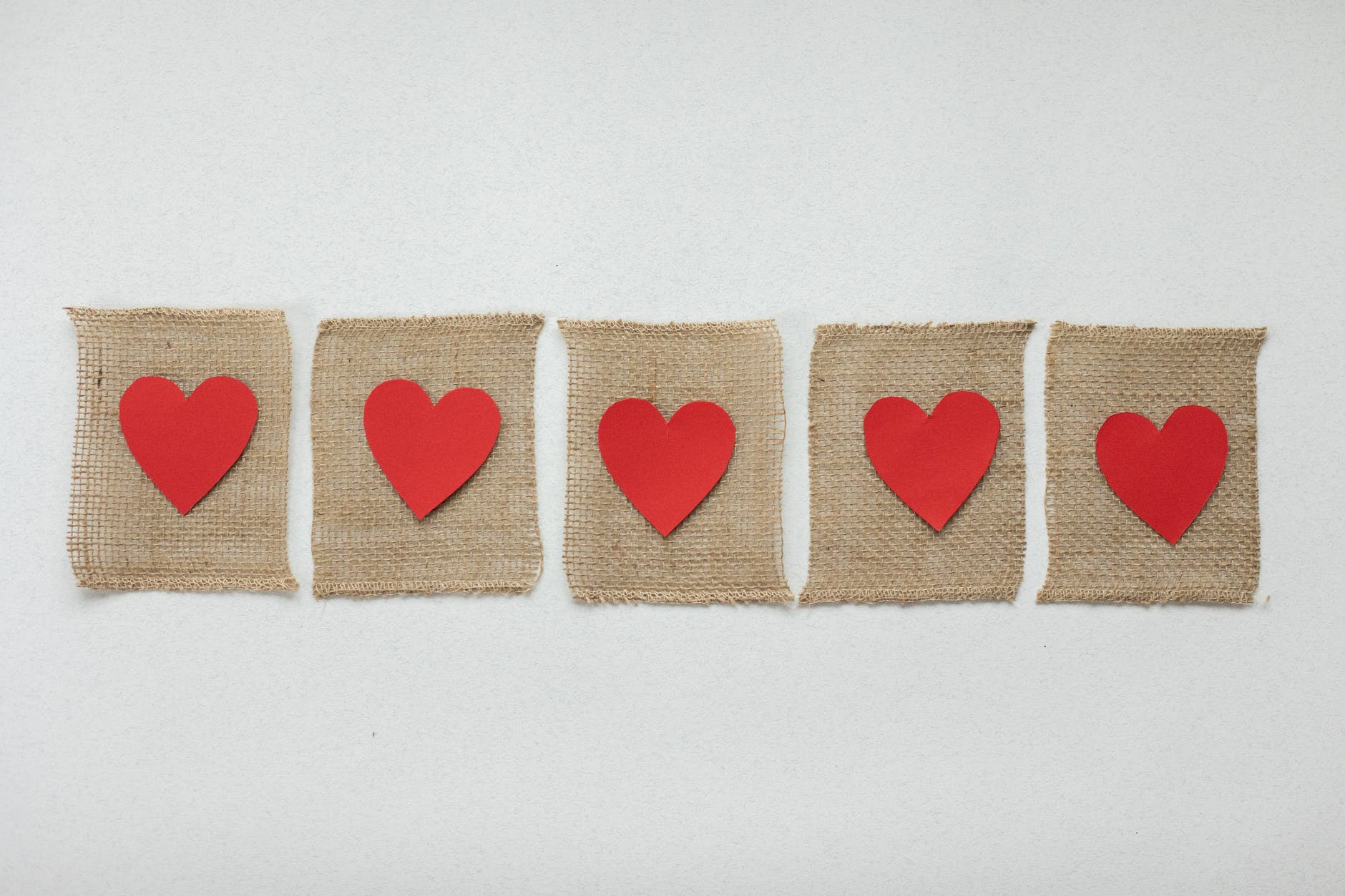 pieces of fabric with red hearts