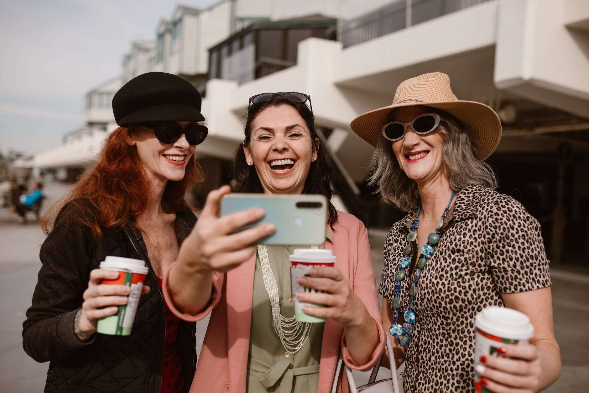 three women taking selfie